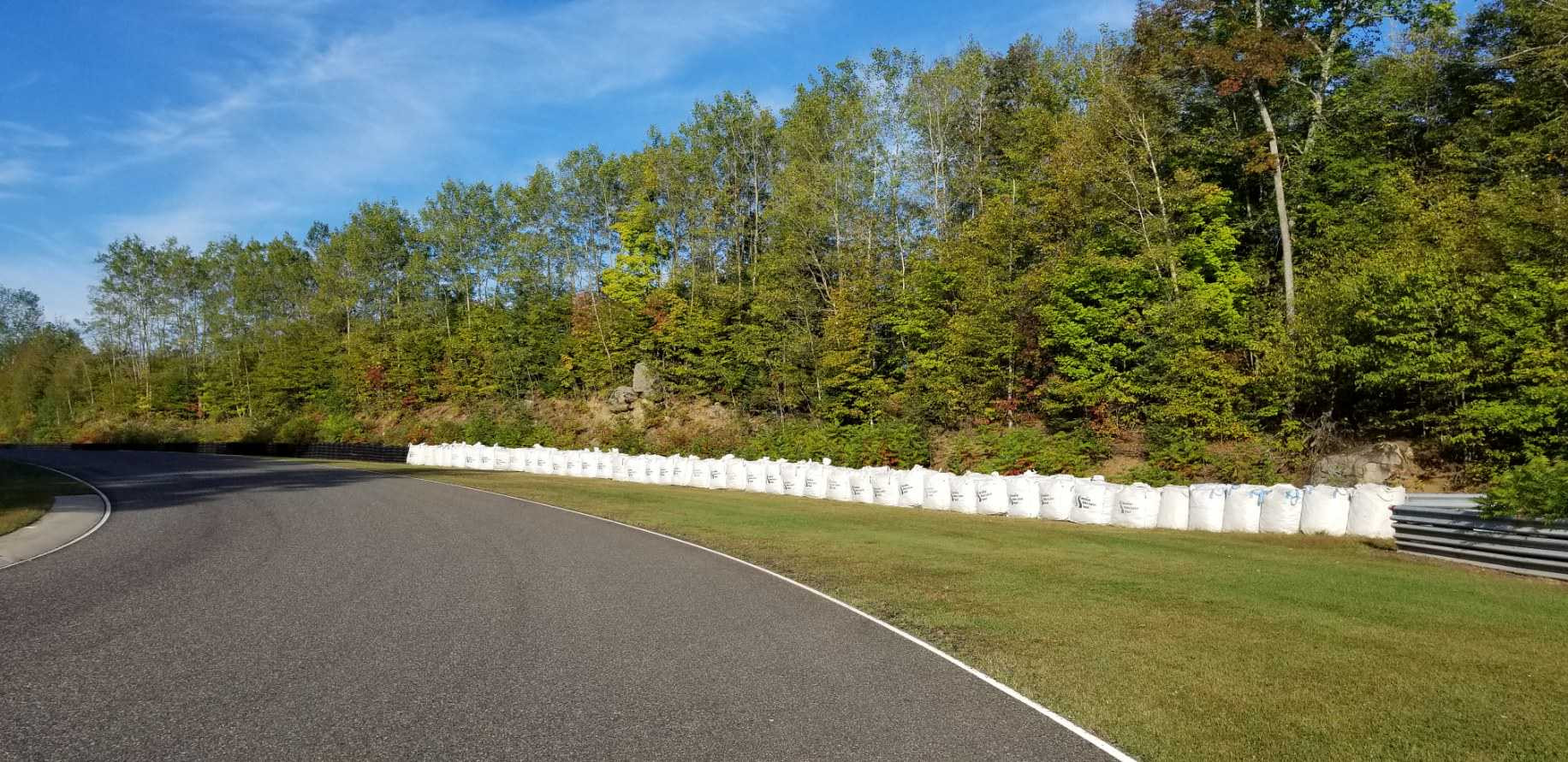 Canadian Rider Fund (CRF) Bottle Bag safety barriers in place trackside in the Turn 13 “Throat” section at Calabogie Motorsports Park, as seen in 2021. Photo courtesy CSBK.