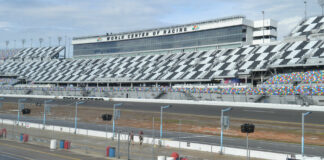 The tri-oval of Daytona International Speedway with water puddles visible on pit lane. Photo by David Swarts.