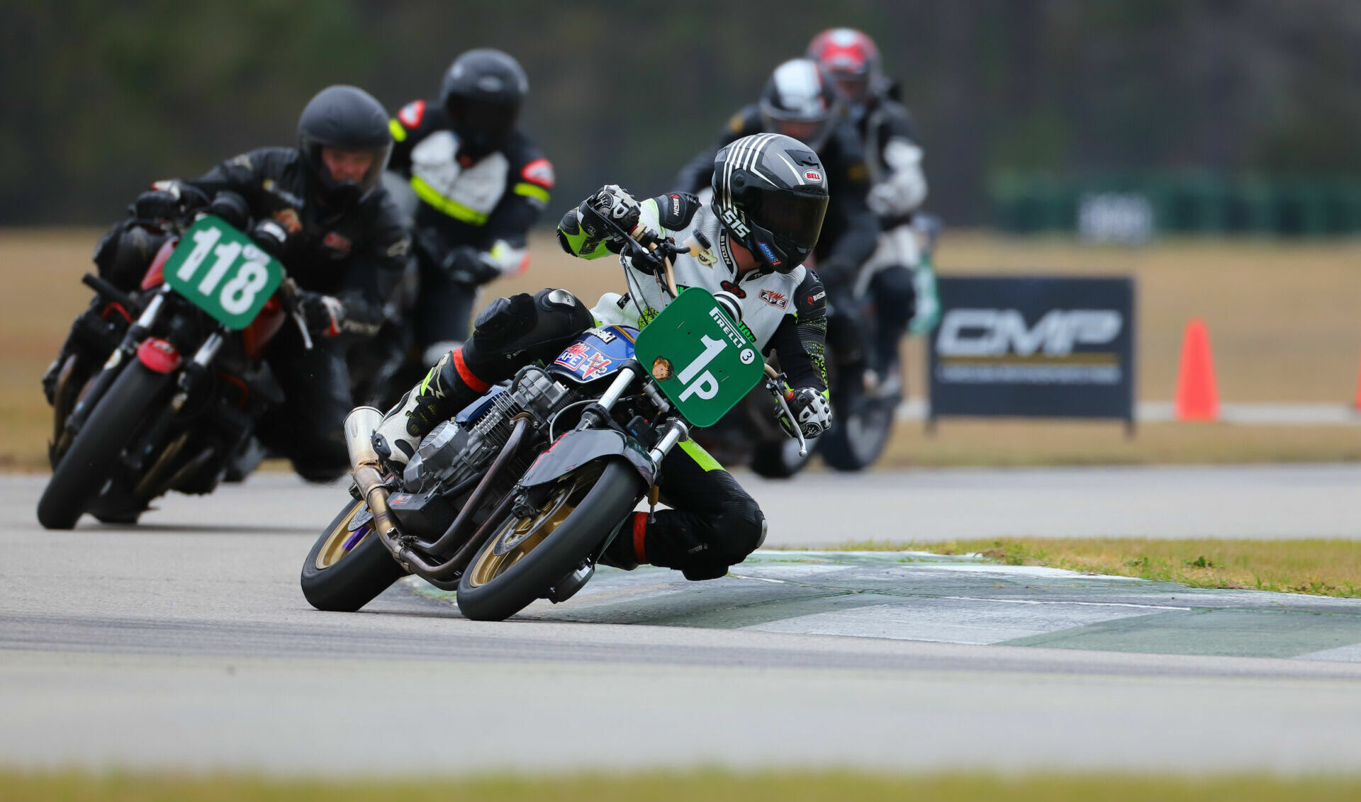 Jeremy Maddrill (1p) leads William Brint (118) during AHRMA Vintage Cup Race Two at Carolina Motorsports Park. Photo by etechphoto.com, courtesy AHRMA.