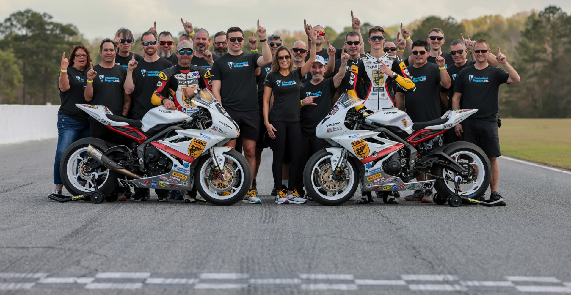 The TOBC Racing team with riders Danny Eslick (left) and Brandon Paasch (right). Photo courtesy Triumph.