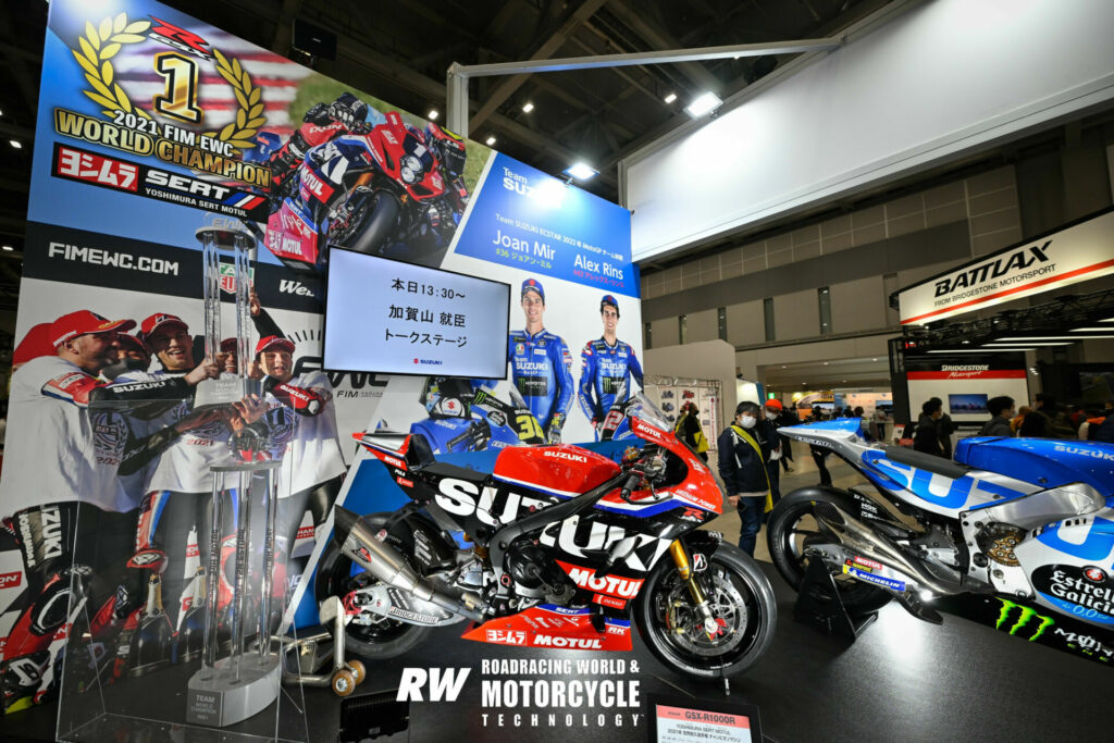 The Yoshimura SERT Motul Suzuki GSX-R1000 endurance racebike with the 2021 FIM Endurance World Championship trophy and one the several Joan Mir ECSTAR Suzuki GSX-RR MotoGP racebikes on display at the show. Photo by Kohei Hirota.