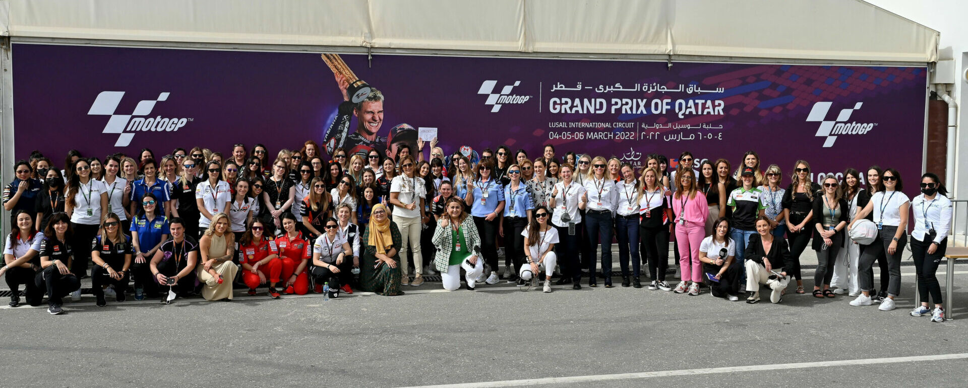 Female team members, officials, and staff at the MotoGP race in Qatar. Photo courtesy FIM.