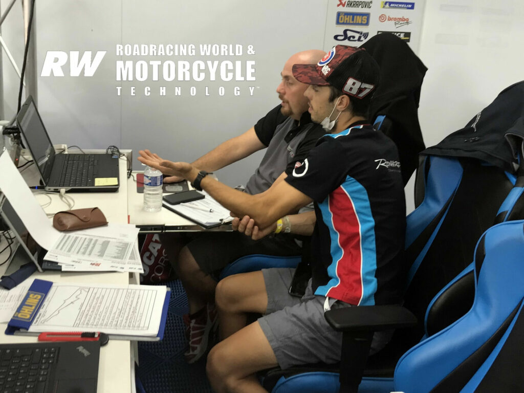 Former Team GoEleven data engineer Fabio Pasqualini discusses electronics strategies with Ducati factory test rider and racer Lorenzo Zanetti, who took Ducati's first MotoAmerica Superbike win. Zanetti was racing with ERC for the Bol d'Or. Photo by Michael Gougis.