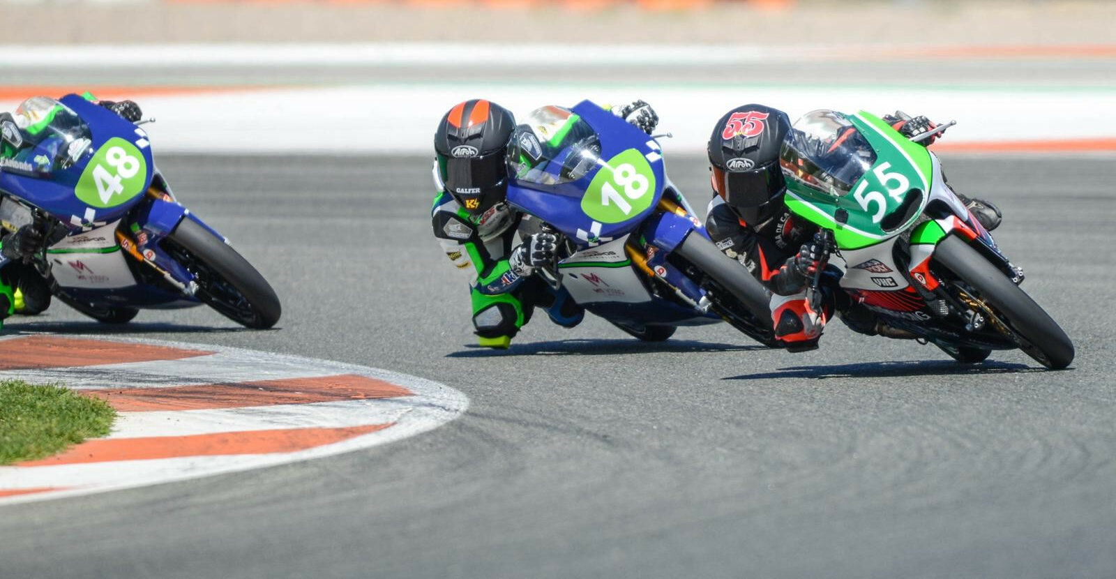 Mikey Lou Sanchez (55) leading two other riders during a RFME ESBK Moto4 race in Valencia, Spain. Photo courtesy Sanchez Racing.