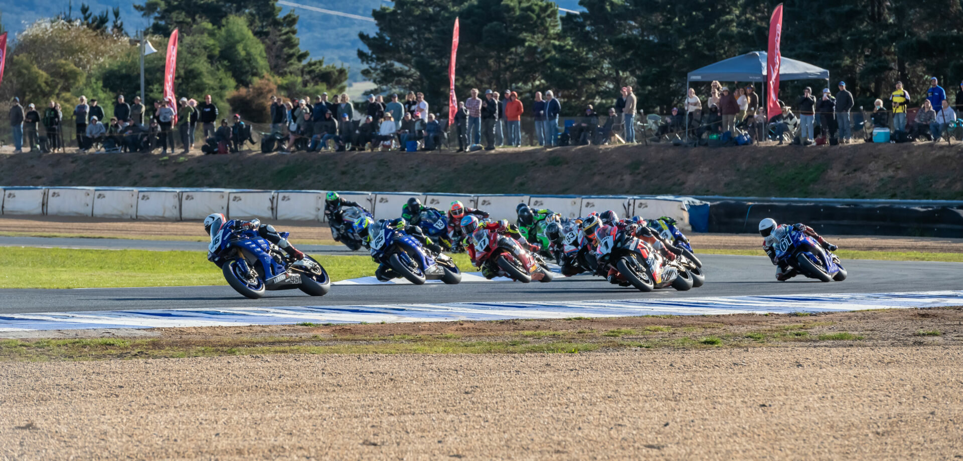 Mike Jones (46) leads the start of Australian Superbike Race Two on Sunday at Wakefield Park Raceway. Photo by Karl Phillipson/optikalphoto, courtesy ASBK.