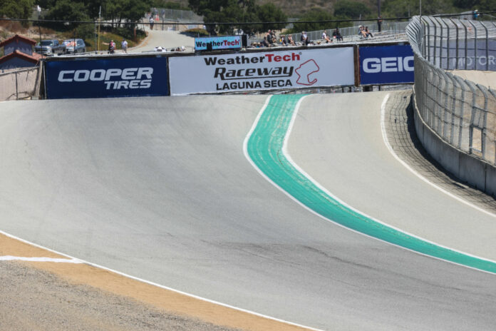 BJN69630_P Turn One at Laguna Seca, as seen from Turn Two with the pedestrian bridge set to be replaced visible in the background. Photo by Brian J. Nelson.