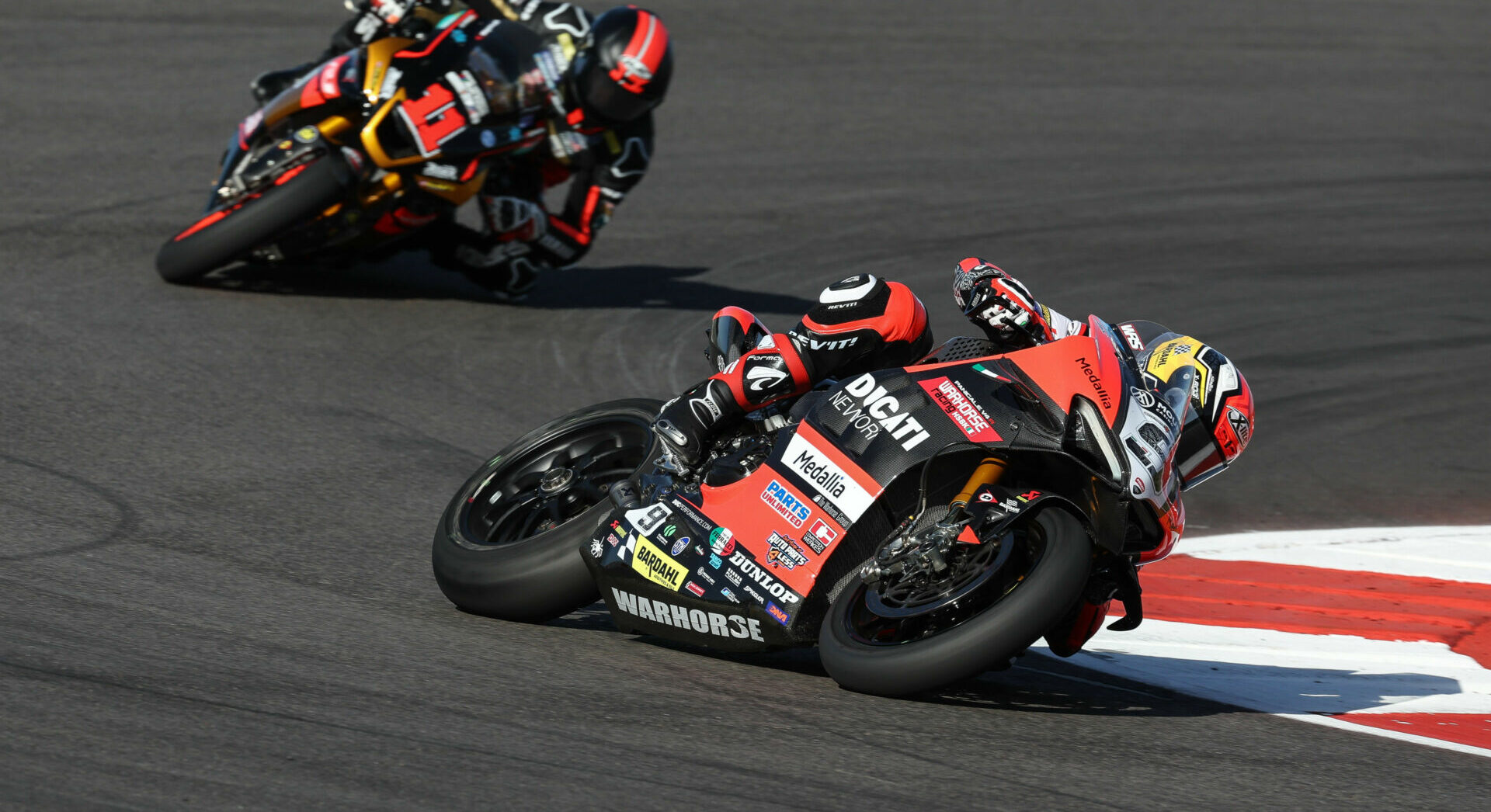 Danilo Petrucci (9) leading Mathew Scholtz (11) during MotoAmerica Medallia Superbike Race One at COTA. Photo by Brian J. Nelson.