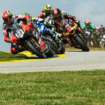 Danilo Petrucci (9) leads a group of riders early in a MotoAmerica Superbike race at Road Atlanta. Photo by Brian J. Nelson, courtesy Ducati.