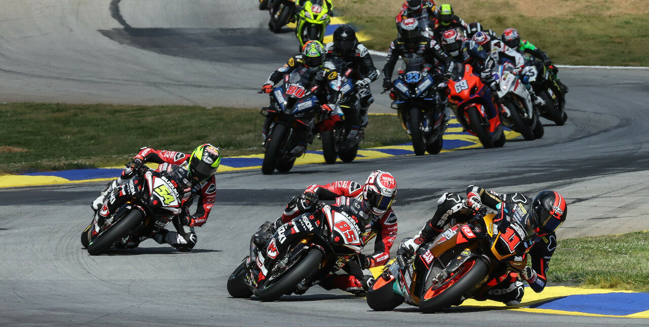 Mathew Scholtz (11) leads Jake Lewis (85), Richie Escalante (54) and the rest of the MotoAmerica Superbike field at Road Atlanta. Photo by Brian J. Nelson, courtesy Westby Racing.