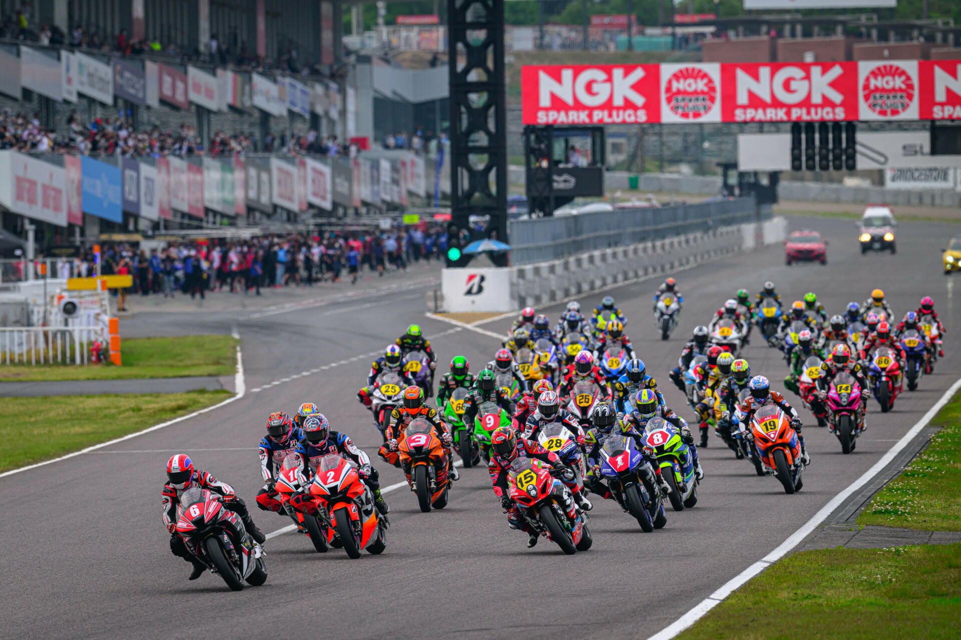 Honda Suzuka Racing Team's Yudai Kamei (6) leads the start of Race One at Suzuka Circuit. Photo by Kohei Hirota.