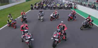 Aprilia stars, present and past, prepare to lead fans on a parade lap at Misano. Photo courtesy Aprilia.