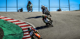 AHRMA 200 Grand Prix+ racers Jon Munns (55), Greg Glevicky (1C), Joe Koury (357) and Tim Manoney (226) navigate the famous Corkscrew during the 2021 AHRMA Classic MotoFest of Monterey at Laguna Seca. Photo by etechphoto.com, courtesy AHRMA.