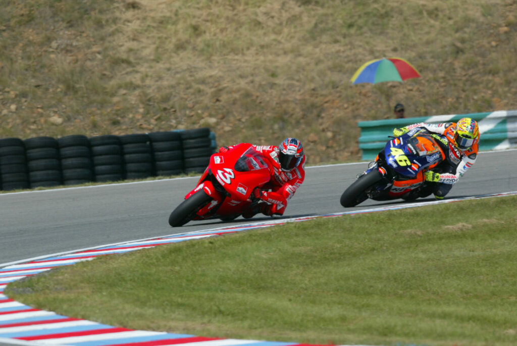 Max Biaggi (3), on a Yamaha YZR-M1, leading longtime rival Valentino Rossi (46), on a Honda RC212V, during a MotoGP race. Photo courtesy Dorna.