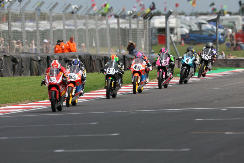 Ryan Hitchcock (43) leads Harrison Dessoy (55), Rhys Stephenson (23), Julian Correa (40), Baily Stuart-Campbell (9), Sullivan Mounsey (4), and Lucas Brown (29) during British Talent Cup Race One at Donington Park. Photo courtesy British Talent Cup.