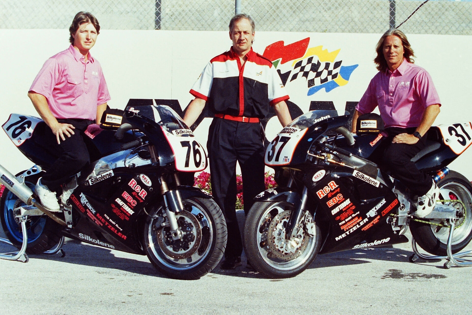 Brett Ray (left) with teammate John Ashmead (right) and Trevor Kemp, a Silkolene representative at the time, at Daytona International Speedway in 1994. Photo by etechphoto.com.