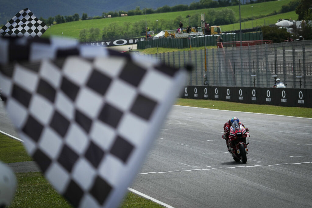 Francesco Bagnaia (63) takes the checkered flag at Mugello. Photo courtesy Dorna.