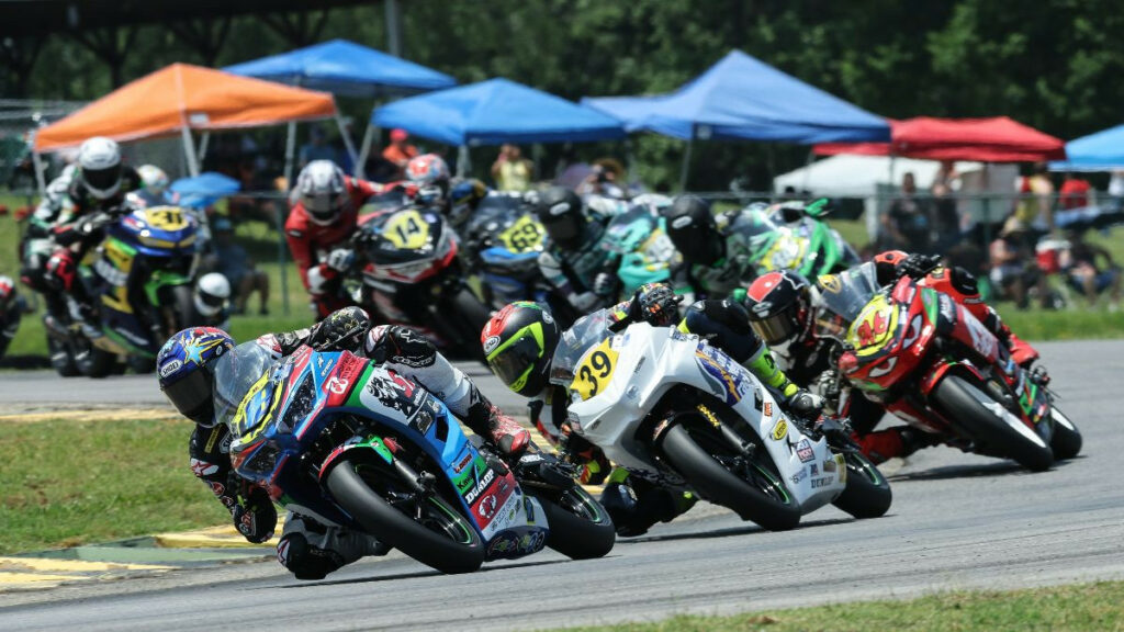 Max Van (48) leads Yandel Medina (39) and Gus Rodio (96) in SportbikeTrackGear.com Junior Cup Race Two. Van won on track but was later disqualified when his bike failed a post-race technical inspection, giving the victory to Cody Wyman. Photo by Brian J. Nelson, courtesy MotoAmerica.
