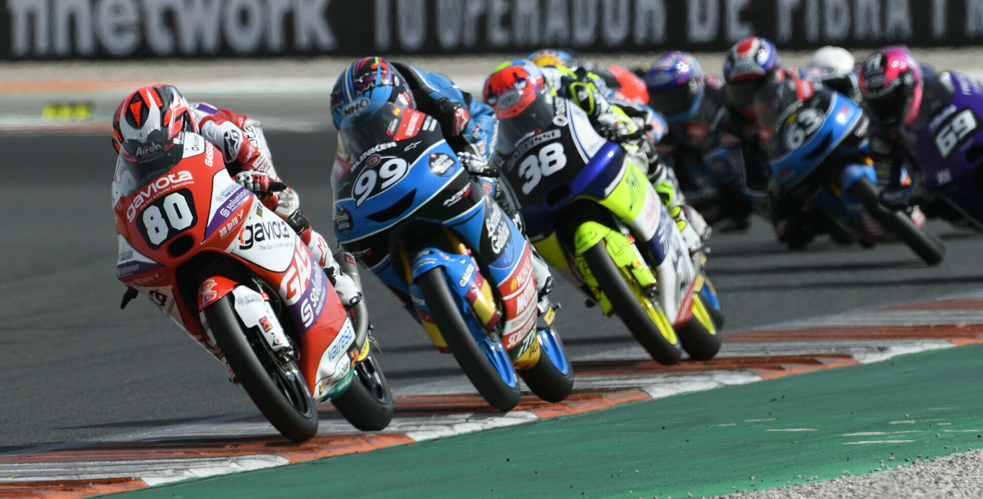 David Alonso (80) leads Jose Rueda (99), David Salvador (38), and the rest of the field during JuniorGP Race One at Valencia. Photo courtesy JrGP.