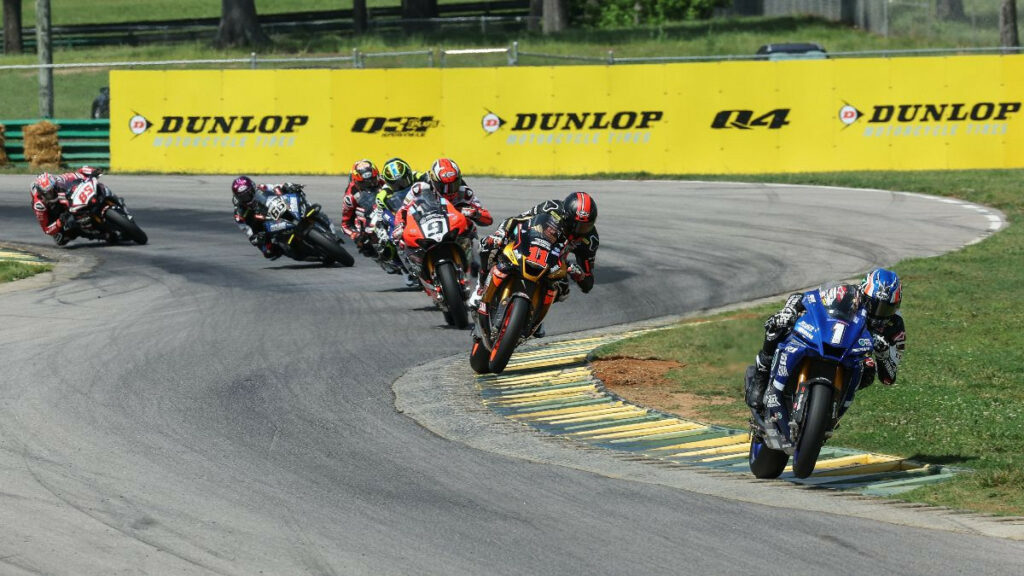 Jake Gagne (1) leads Mathew Scholtz (11), Danilo Petrucci (9), and the rest of the MotoAmerica Medallia Superbike field early in Race Two at VIR. Photo by Brian J. Nelson, courtesy MotoAmerica.