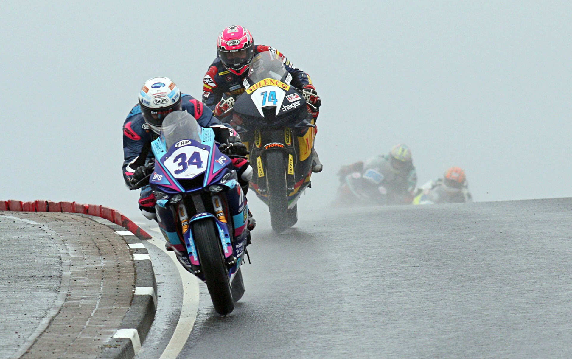 Alastair Seeley (34) leading Davey Todd (74) during the Supersport race Thursday evening at the North West 200. Photo courtesy North West 200 Press Office.