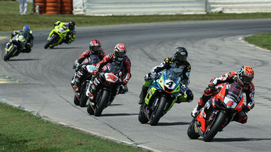 Josh Herrin (2) leads Josh Hayes (4), Tyler Scott (70), Sam Lochoff (44), and the rest en route to victory in an extremely close and action-packed Supersport Race Two at VIR on Sunday. Photo by Brian J. Nelson, courtesy MotoAmerica.