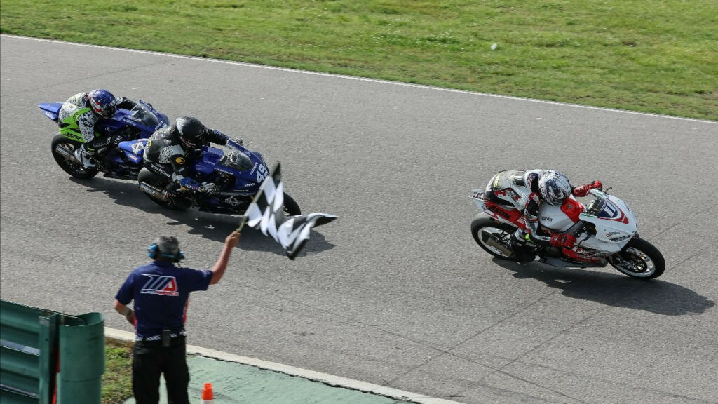 Jody Barry (11) beat Hayden Schultz (49) and James Rispoli (behind Schultz) in Twins Cup Race Two. Photo by Brian J. Nelson, courtesy MotoAmerica. 