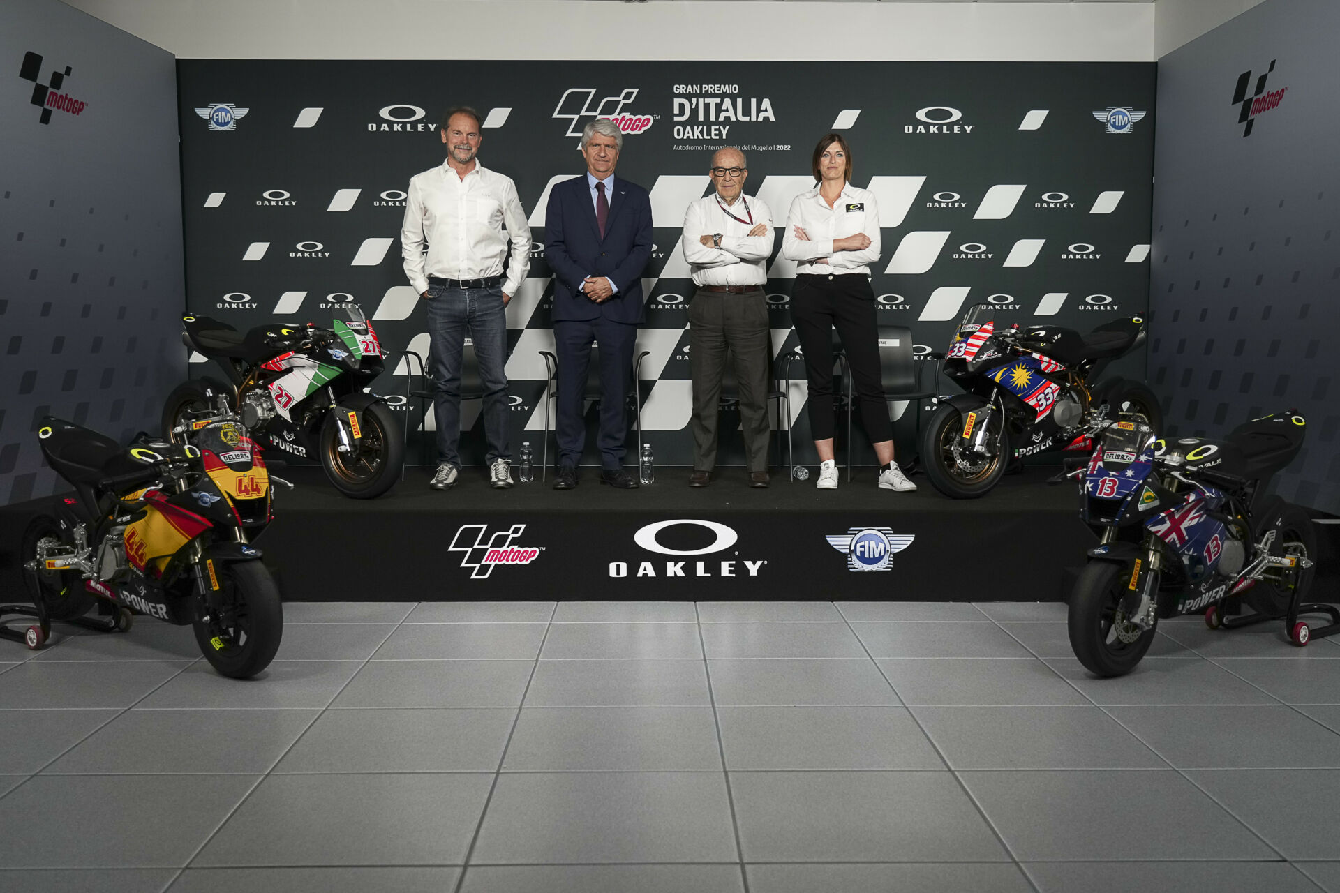 (From left) Pirelli Head of Motorsport BU Moto Giorgio Barbier, FIM President Jorge Viegas, Dorna CEO Carmelo Ezpeleta, and Ohvale’s Head of Communication and Marketing Marica Barbiero with Ohvale mini road race motorcycles at a press conference at Mugello. Photo courtesy Dorna.