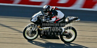 Before crash-testing safety gear and smashing race bodywork: The author and his Honda CBR600RR on the banking at Auto Club Speedway, wearing an Arai Regent-X helmet, AGV Monza one-piece racing suit and gloves, Alpinestars Supertech R boots and body armor. All performed without fail. Photo courtesy Caliphotography.com.