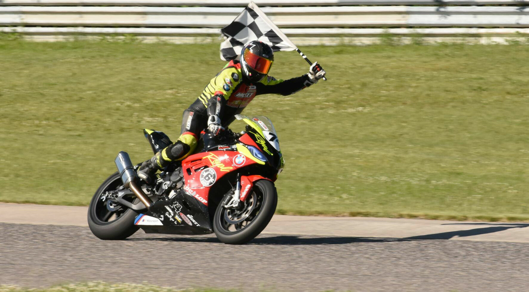 Michael Leon (74) celebrating his victory at Calabogie Motorsports Park. Photo by Colin Fraser, courtesy PMP.