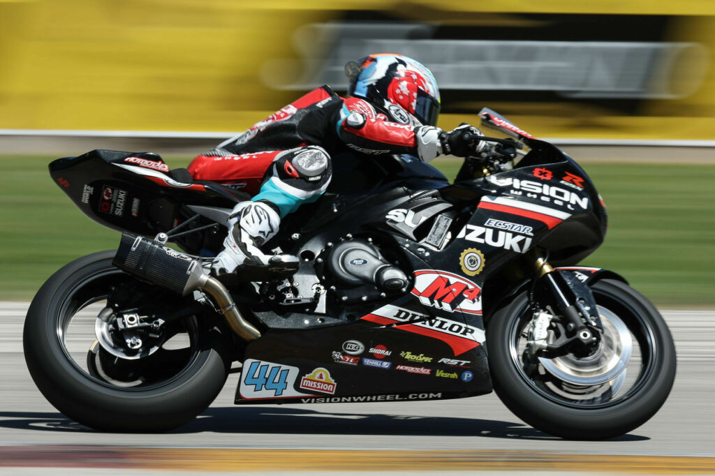 Sam Lochoff (44) powering his GSX-R750 into the top ten of the next generation Supersport Class. Photo courtesy Suzuki Motor USA, LLC.