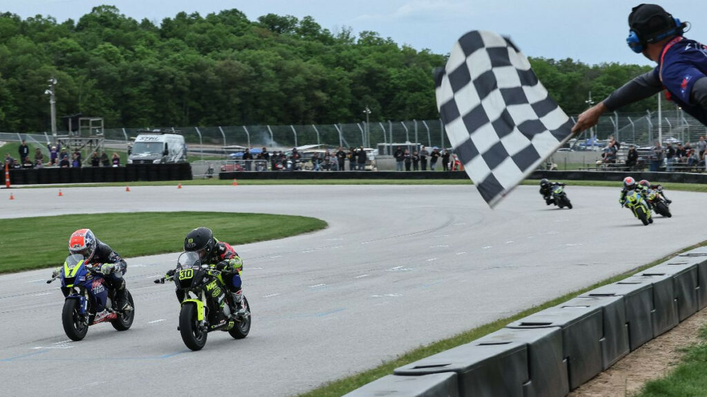 Kensei Matsudaira (1) and Mac MacClugage (3) raced to the line in both 160cc classes during MotoAmerica Mini Cup by Motul races on Saturday evening at Road America. The two split wins in the pair of races. Photo by Brian J. Nelson, courtesy MotoAmerica.