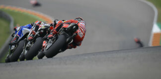 Alex Rins leads Takaaki Nakagami and Francesco Bagnaia at Sachsenring in 2021. Photo courtesy Dorna.