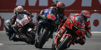 Francesco Bagnaia (63) leads Fabio Quartararo (20), Takaaki Nakagami (30), and Maverick Vinales early in the MotoGP race at Assen in 2021. Photo courtesy Dorna.