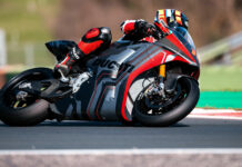 Ducati's V21L electric prototype at speed on a racetrack. Photo courtesy Ducati.