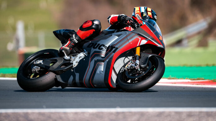 Ducati's V21L electric prototype at speed on a racetrack. Photo courtesy Ducati.