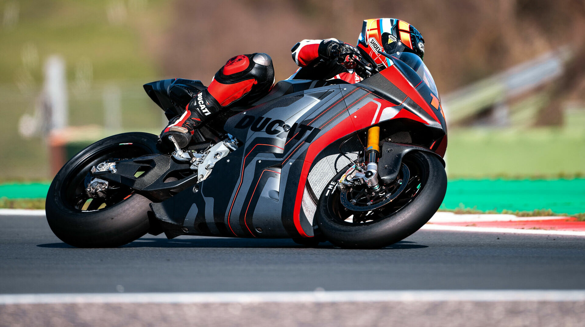 Ducati's V21L electric prototype at speed on a racetrack. Photo courtesy Ducati.