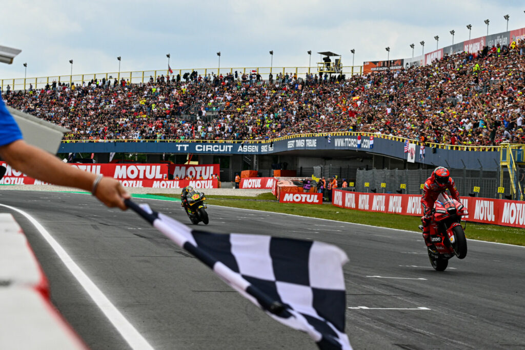 Francesco Baganaia (63) leads Marco Bezzecchi (72) to the checkered flag at Assen. Photo courtesy Dorna.