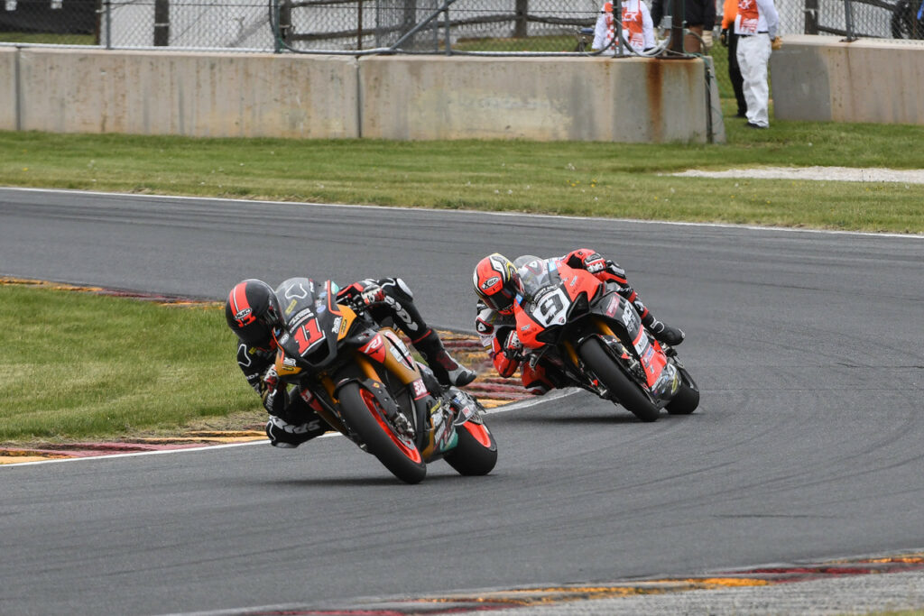 Mathew Scholtz (11) leading Danilo Petrucci (9). Photo by Brian J. Nelson, courtesy Westby Racing.