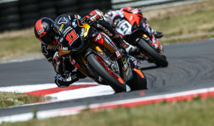 Mathew Scholtz (11) and Danilo Petrucci (9) on track together Friday at Ridge Motorsports Park. Photo by Brian J. Nelson.
