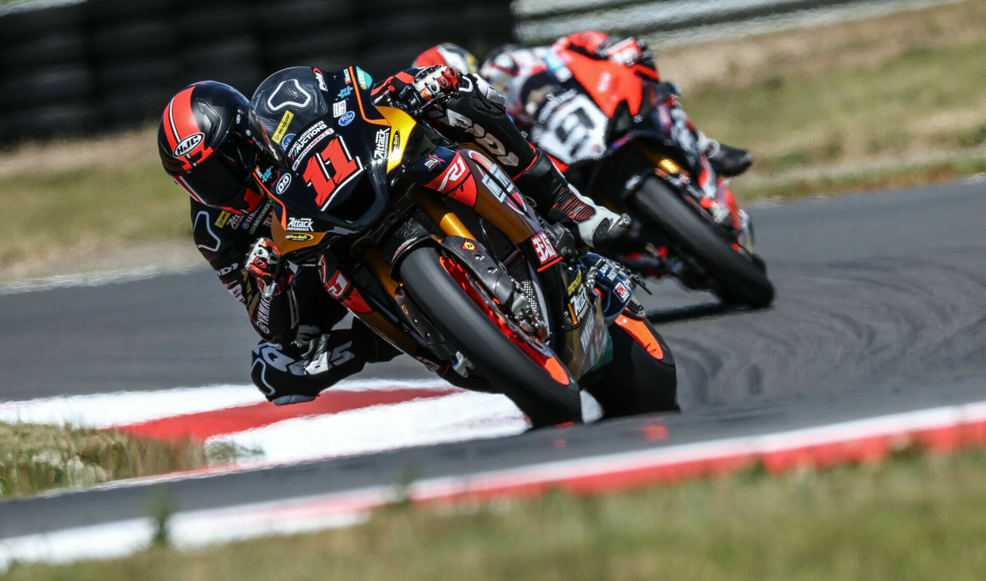 Mathew Scholtz (11) and Danilo Petrucci (9) on track together Friday at Ridge Motorsports Park. Photo by Brian J. Nelson.