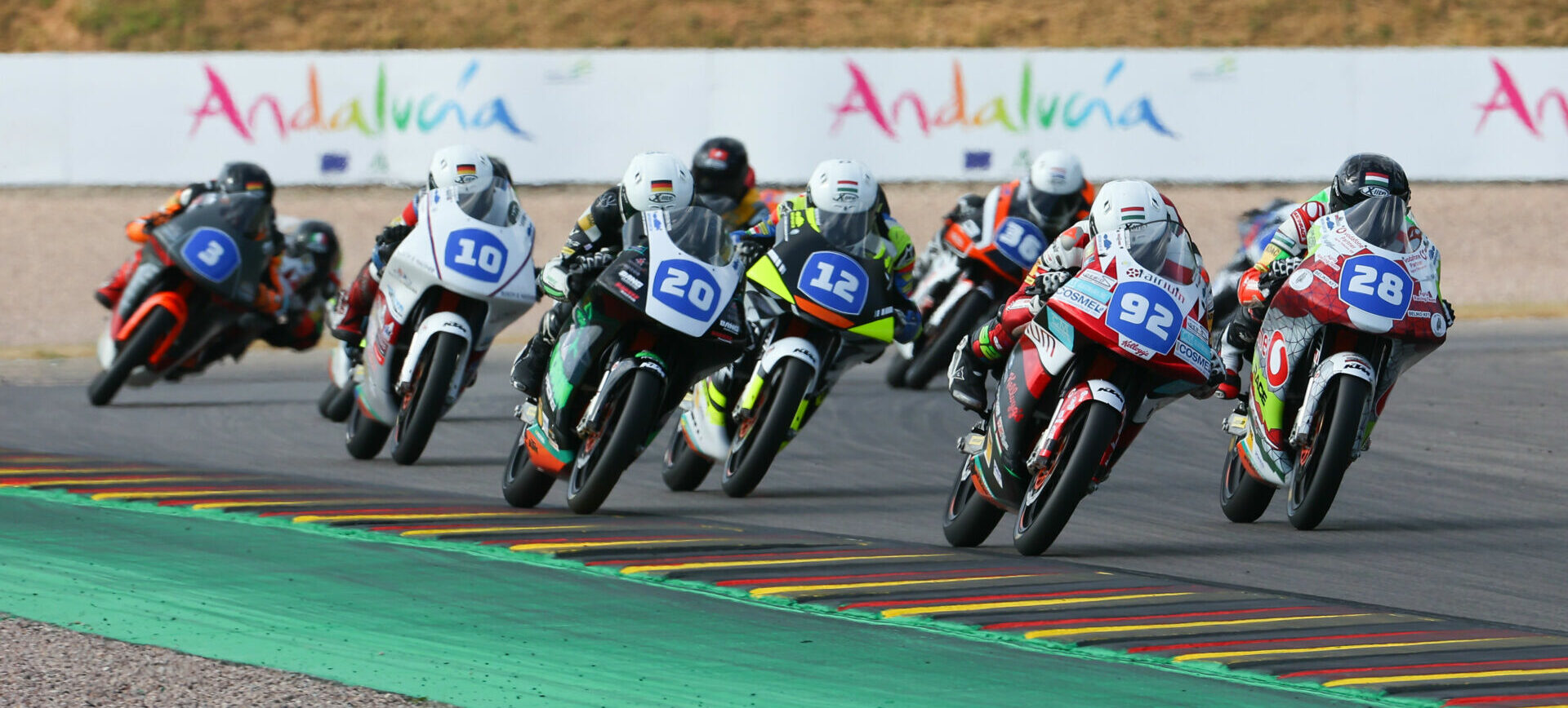 American-born Rossi Moor (92) leading Kevin Farkas (28), Dustin Schneider (20), and the rest during Northern Talent Cup Race Two at Sachsenring in 2022. Photo courtesy Dorna.