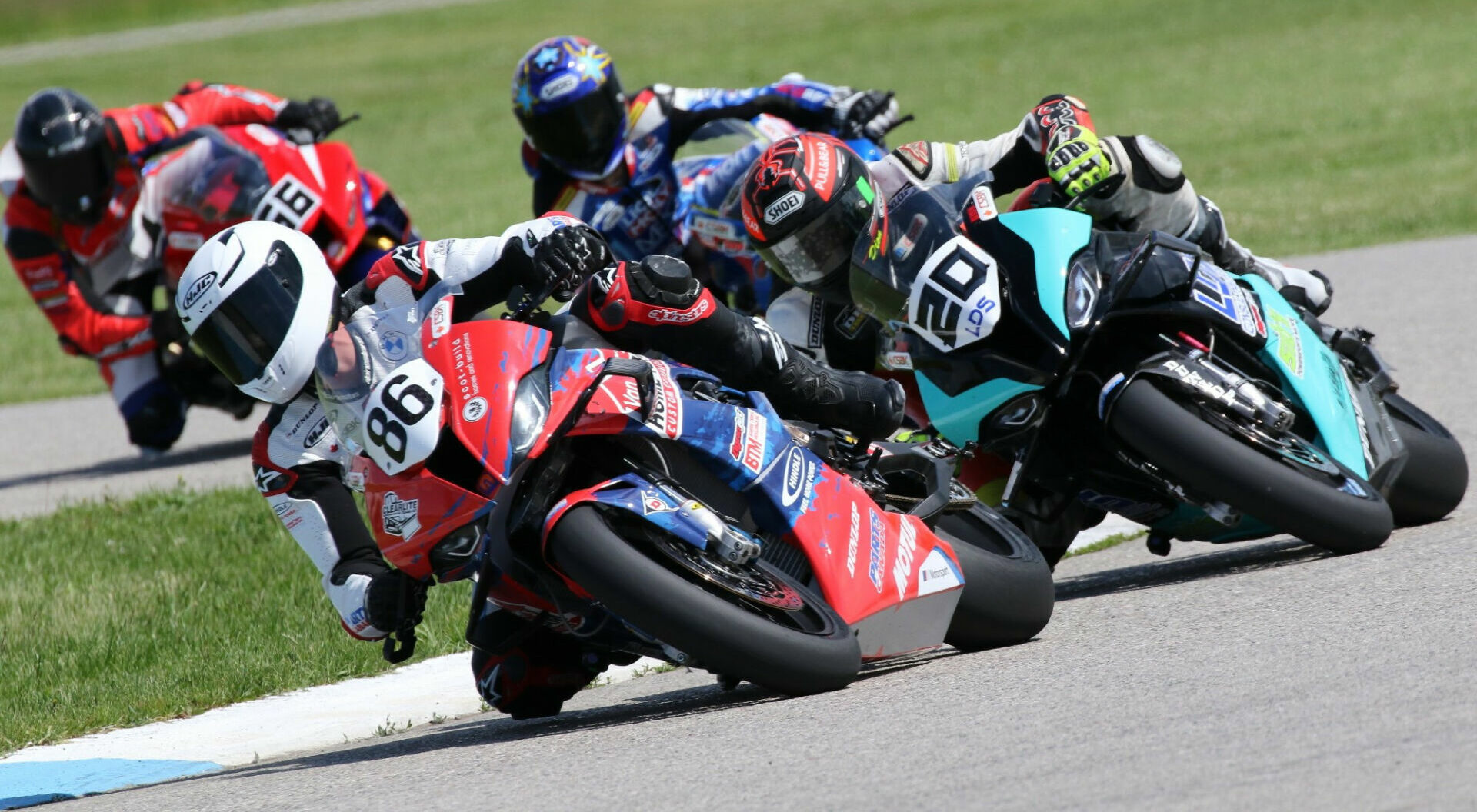 Ben Young (86) leads Trevor Dion (20) at Grand Bend Motorplex. Photo by Rob O’Brien, courtesy CSBK.