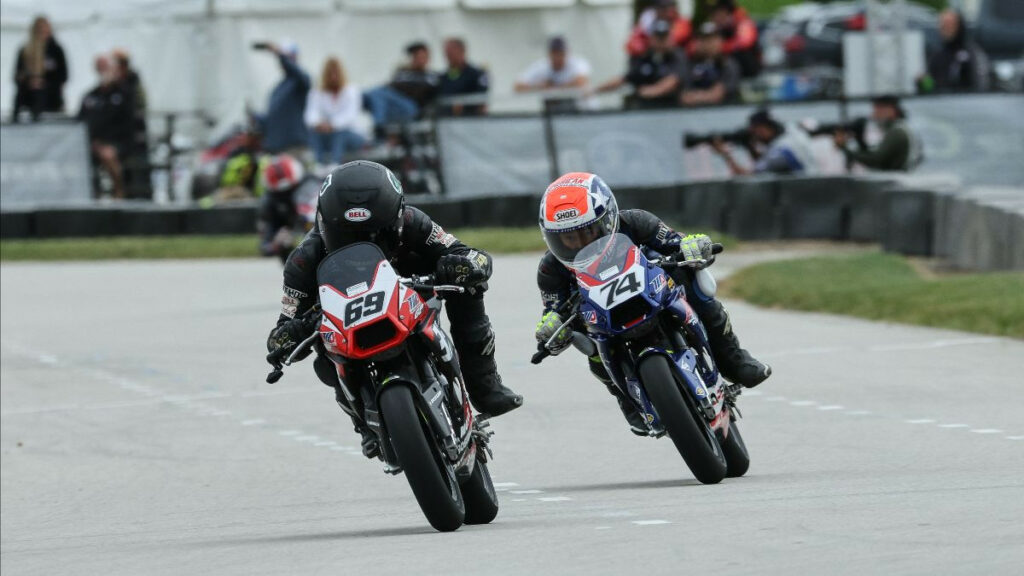 Jesse James Shedden (69) leads Matsudaira (74) in 190cc class action at the Briggs & Stratton Motorplex. Photo by Brian J. Nelson, courtesy MotoAmerica.