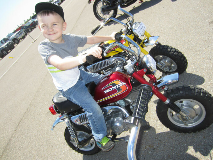 A young motorcycle enthusiast on a vintage Honda minibike. Photo by Maurice Laroque-Turgeau, courtesy AHRMA.
