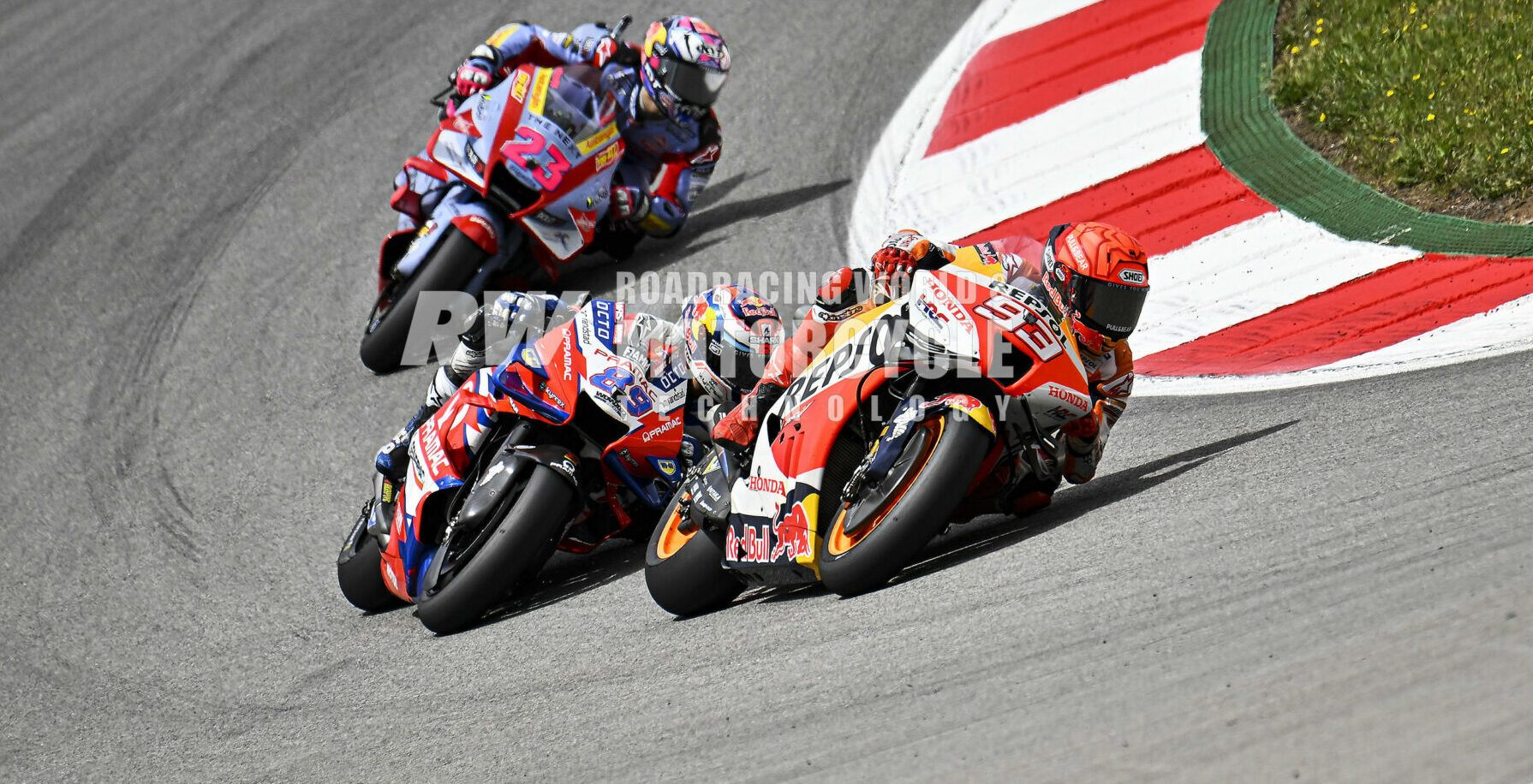 Jorge Martin (89) and Enea Bastianini (23) chase Marc Marquez (93) in a MotoGP race held earlier this season at Portimao, Portugal. Photo by Gigi Soldano/DPPI Media.