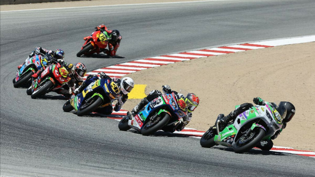 Cody Wyman (34) leads Joe LiMandri (62), Kayla Yaakov (31) and Gus Rodio (96) en route to victory in the SportbikeTrackGear.com Junior Cup race. Photo by Brian J. Nelson.