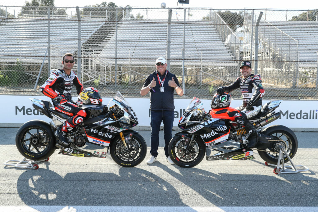 Medallia President and CEO Leslie Stretch (center) with Warhorse HSBK Racing Ducati NYC riders Danilo Petrucci (left) and Josh Herrin (right). Photo by Brian J. Nelson, courtesy Ducati North America.