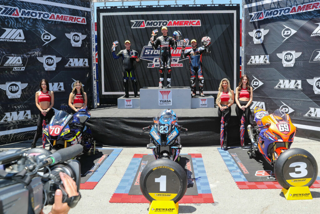 Corey Alexander (center), after beating runner-up Bryce Prince (left), and third-place finisher Hayden Gillim (right) in the lone Stock 1000 race at Laguna Seca. Photo by Brian J. Nelson, courtesy Tytler Cycle/RideHVMC Racing.