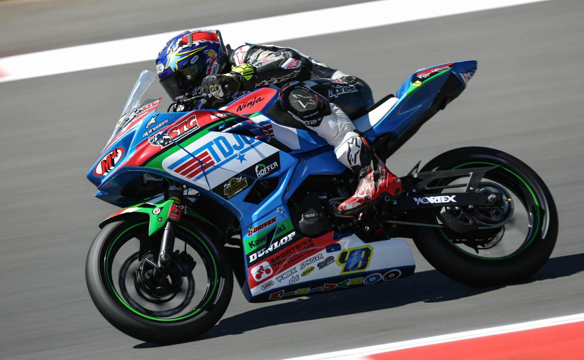 Max Van (48) at speed on his SportbikeTrackGear.com Kawasaki Ninja 400. Photo by Brian J. Nelson.