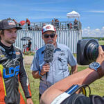 BS Batteries Pole Award winner Trevor Dion discusses his Grand Bend performance with TSN Host Frank Wood under the watchful eye of camera man Michael Brown. Photo by Colin Fraser, courtesy CSBK/PMP.